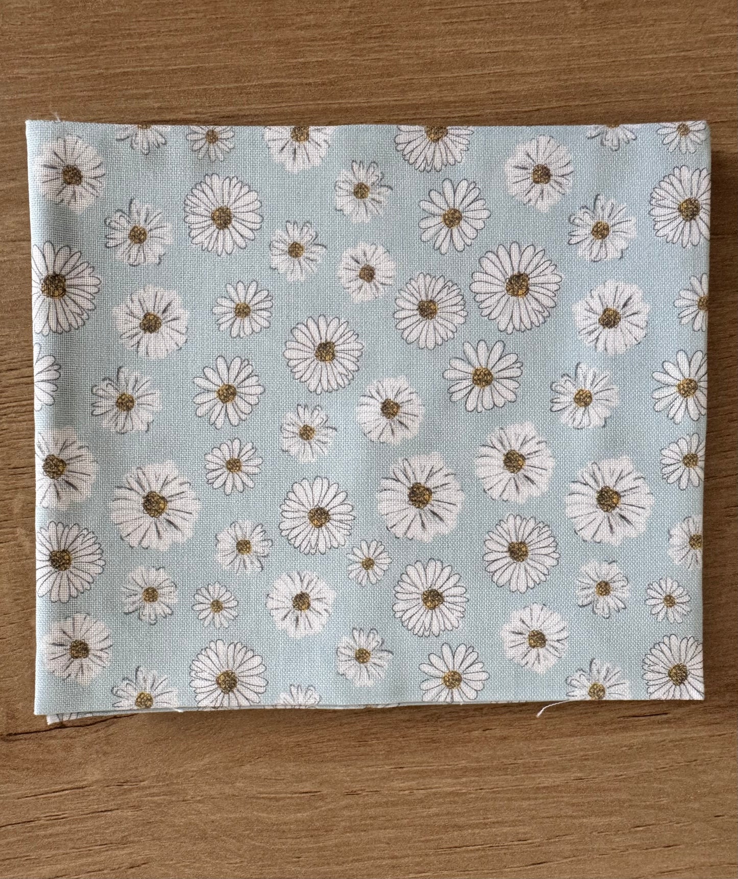 Daisy dream on mint cotton fabric as part of Wild Flowers fabric collection by Holly Dennett